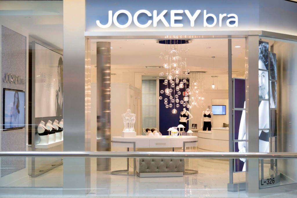 Jockey bra boutique storefront at Woodfield Mall with illuminated signage and a modern retail interior.
