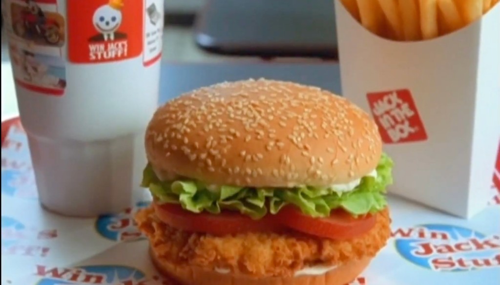 Jack in the Box combo meal with Win Jack's Stuff game pieces on the drink cup, fries carton, and tray liner.